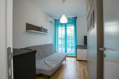 a living room with a couch and a window at Belgrade apartment Skadarlija II in Belgrade