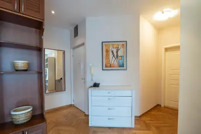 a bathroom with a white dresser and a mirror at Belgrade Center Apartment Lux II in Belgrade