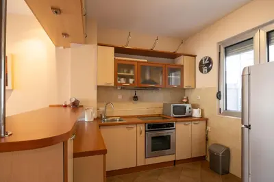 a small kitchen with a sink and a microwave at Belgrade Center Apartment Lux II in Belgrade