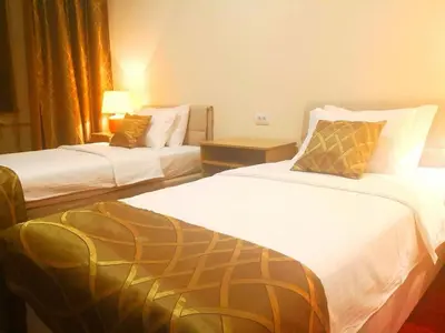 a hotel room with two beds in a room at Hotel N in Belgrade