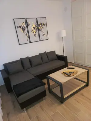 a living room with a couch and a coffee table at Sancho Leone in Belgrade