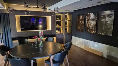 a dining room with a table and chairs at Design Hotel Mr President in Belgrade