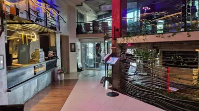a restaurant with a lobby with a fire place at Design Hotel Mr President in Belgrade
