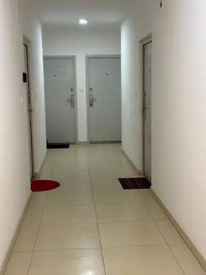 a hallway with three doors and a tile floor at Port 2 in Belgrade