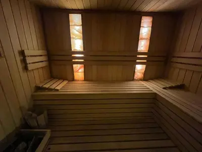 an inside of a sauna with two windows at Wolf Spa Apartment in Belgrade