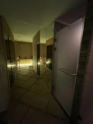 an empty room with a hallway with a refrigerator at Wolf Spa Apartment in Belgrade