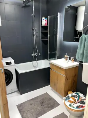 a bathroom with a shower and a toilet and a sink at Fairy tale apartment in Dušanovac (historical)