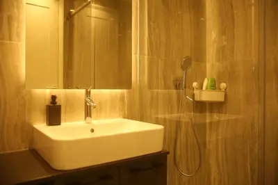 a bathroom with a sink and a mirror at Natalie's Condo in Belgrade