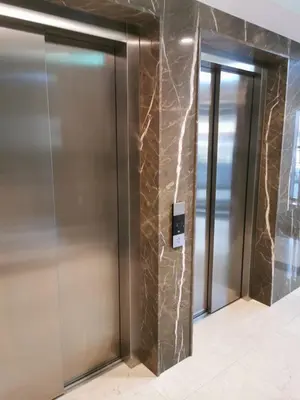 an elevator lobby with two elevators in a building at Natalie's Condo in Belgrade