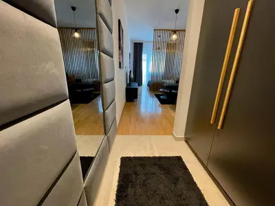 a hallway with a living room and a living room with at LL65 Apartments Vracar in Belgrade