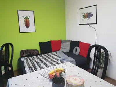 a living room with a couch and a table at NeraBella Apartment in Belgrade