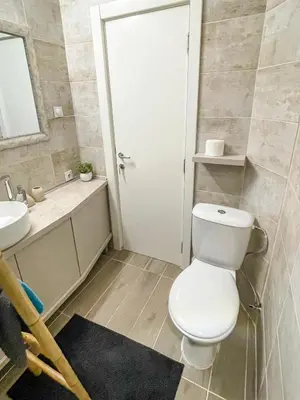 a bathroom with a toilet and a sink at Skadarlija ColorWay in Belgrade