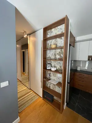 a kitchen with a cabinet with dishes in it at Happy Corner New Belgrade in Novi Beograd