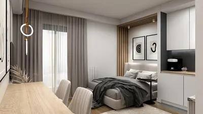 a bedroom with a bed and a table in it at Apartman Grand BW in Belgrade