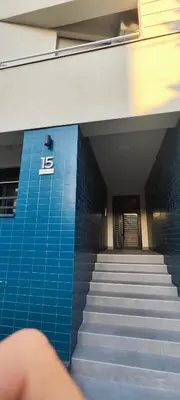a staircase leading to a building with a sign on it at Zvezdara blue star in Zvezdara