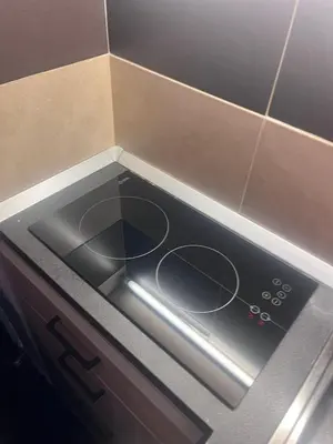 a stove top oven sitting inside of a kitchen at Mala Bella in Zemun