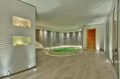 a large bathroom with a tub in the middle at Hotel Moskva in Belgrade