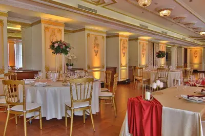 a banquet hall with white tables and chairs at Hotel Moskva in Belgrade
