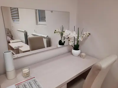 a white room with a table and a mirror at Aleksa 1 in Belgrade