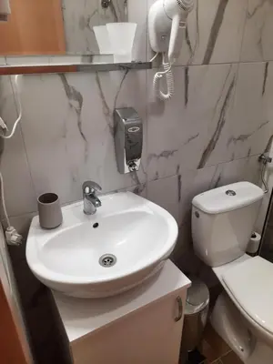 a bathroom with a white sink and a toilet at Aleksa 2 in Belgrade