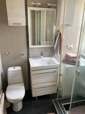 a small bathroom with a toilet and a sink at Home Center Apartment in Belgrade