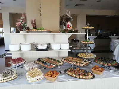 a buffet with many different types of food on a table at Hotel Srbija-FREE PARKING in Belgrade