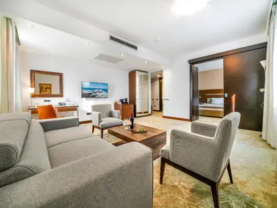 a living room with a couch and chairs at IN Hotel Beograd in Belgrade