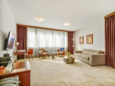a living room with a couch and a table at IN Hotel Beograd in Belgrade