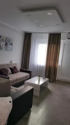 a living room with a couch and a coffee table at Zone Dedinje in Dedinje