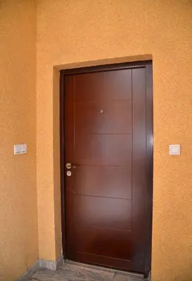 a large wooden door in a building at Studio Milan in Vračar (historical)