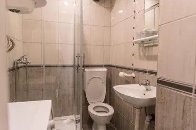 a bathroom with a toilet and a sink at Cube23 in Belgrade