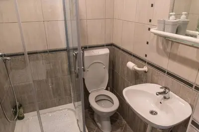 a bathroom with a toilet and a sink at Cube23 in Belgrade