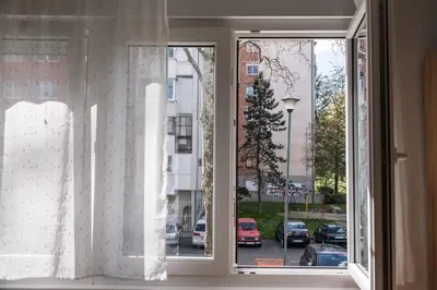an open window with a view of a parking lot at Cube23 in Belgrade