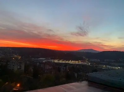 a view of a sunset from the roof of a building at Hotel Villa Panorama in Belgrade