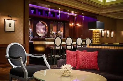 a living room with a couch and a bar at Hyatt Regency Belgrade in Belgrade