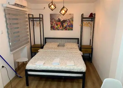 a small bedroom with a bed in a room at Cozy & fully equipped studio in the heart of downtown and next to Kalemegdan in Belgrade