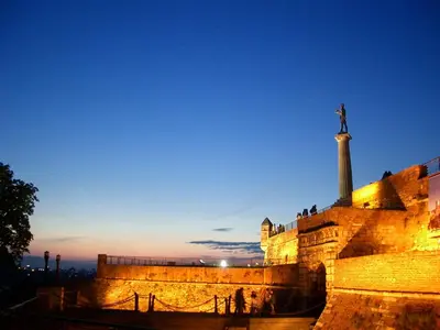 a statue on top of a building with the sky at Cozy & fully equipped studio in the heart of downtown and next to Kalemegdan in Belgrade