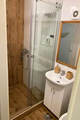 a bathroom with a shower and a sink at Cozy & fully equipped studio in the heart of downtown and next to Kalemegdan in Belgrade