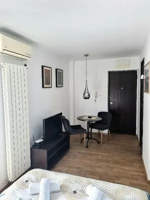 a living room with a table and a dining room at Dixy 2 in Belgrade
