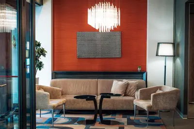 a living room with a couch and chairs and a chandelier at Boutique Hotel Townhouse 27 in Belgrade