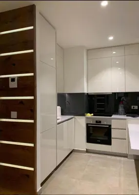 a kitchen with white cabinets and a stove at Belgrade Waterfront Wolf in Sajmište