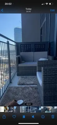 a screen shot of a balcony with a couch on a balcony at Belgrade Waterfront Wolf in Sajmište