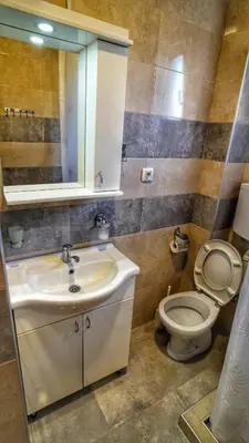 a bathroom with a sink and a toilet at President 034 Deluxe in Arandjelovac