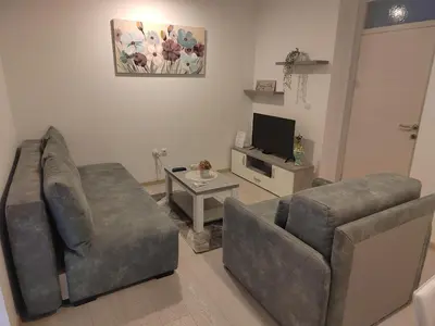 a living room with two couches and a television at President 034 Deluxe in Arandjelovac