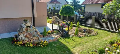 a garden with a rock staircase in a yard at President 034 Deluxe in Arandjelovac