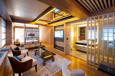 a living room with a couch and a bed at Hanami Design Hotel in Belgrade