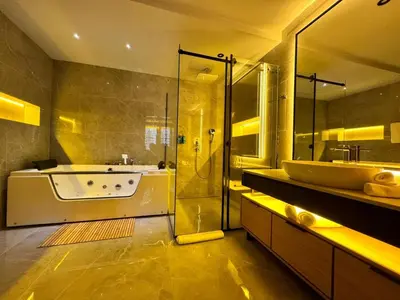 a bathroom with a tub and a sink and a shower at Hanami Design Hotel in Belgrade