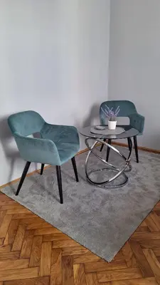 two chairs and a table in a living room at Apartment Nataly in Vračar (historical)