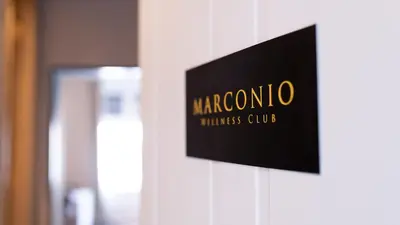 a sign on the wall of a hotel room at Marconio Luxury city center apartment with own spa zone in Belgrade