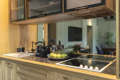a kitchen counter with a bowl of fruit on it at Marconio Luxury city center apartment with own spa zone in Belgrade